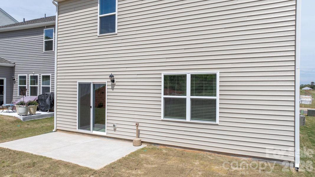 Exterior details and patio area of a home in The Hamptons at Hickory, Hickory (Image 22).