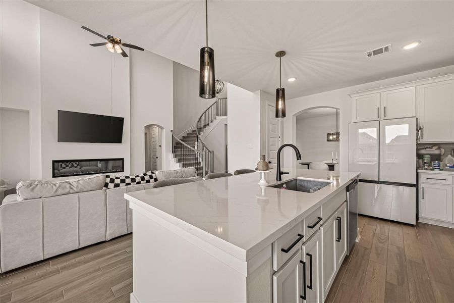The kitchen overlooks the family room, making it easy to stay connected while cooking. The kitchen overlooks the family room, making it easy to stay connected while cooking.