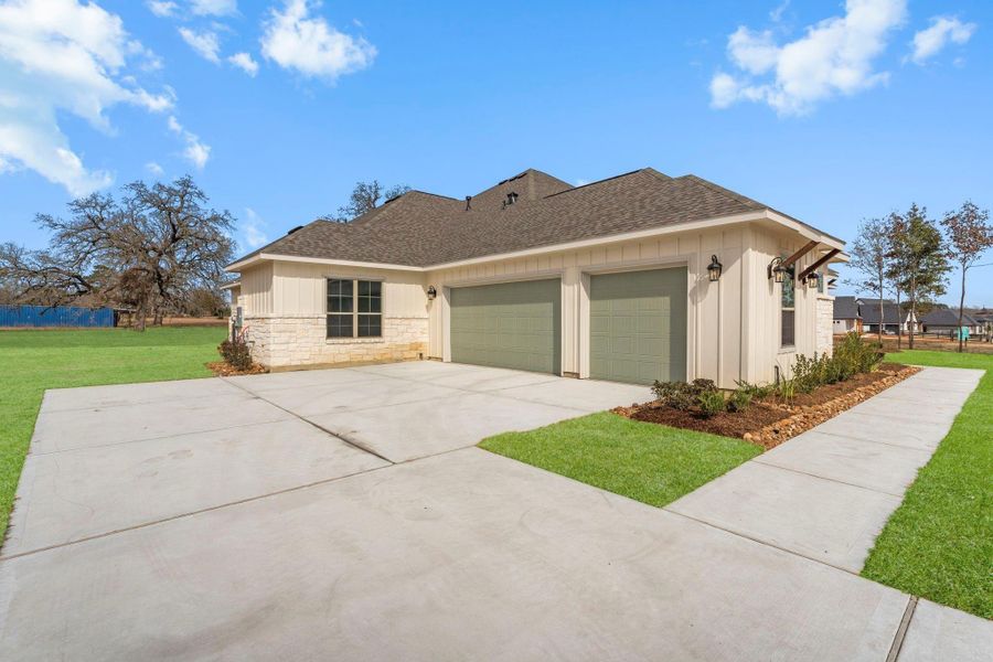 Front exterior of a new home in Chapel Bend, Montgomery, TX, highlighting curb appeal (Image 18).