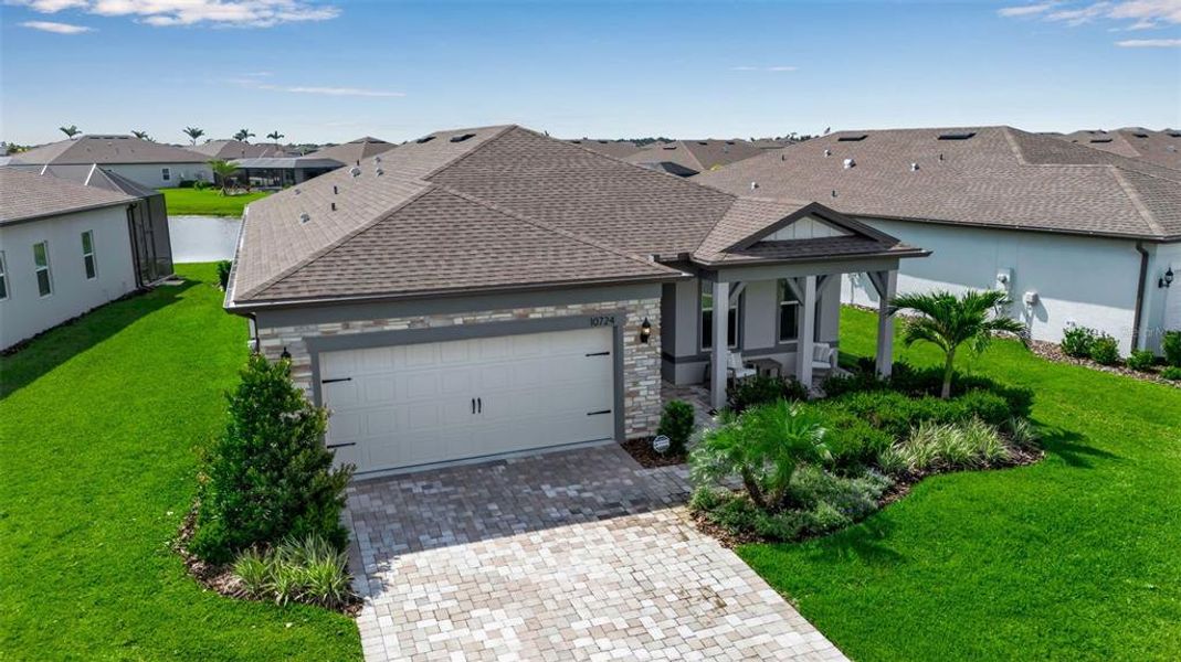 Front exterior of a new home in Del Webb BayView, Parrish, FL, highlighting curb appeal (Image 20). Front exterior of a new home in Del Webb BayView, Parrish, FL, highlighting curb appeal (Image 20).