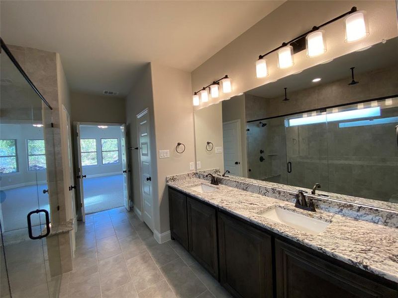 Master Bathroom featuring dual vanities