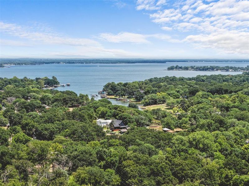 Expansive water body with forested shoreline and scattered properties Expansive water body with forested shoreline and scattered properties