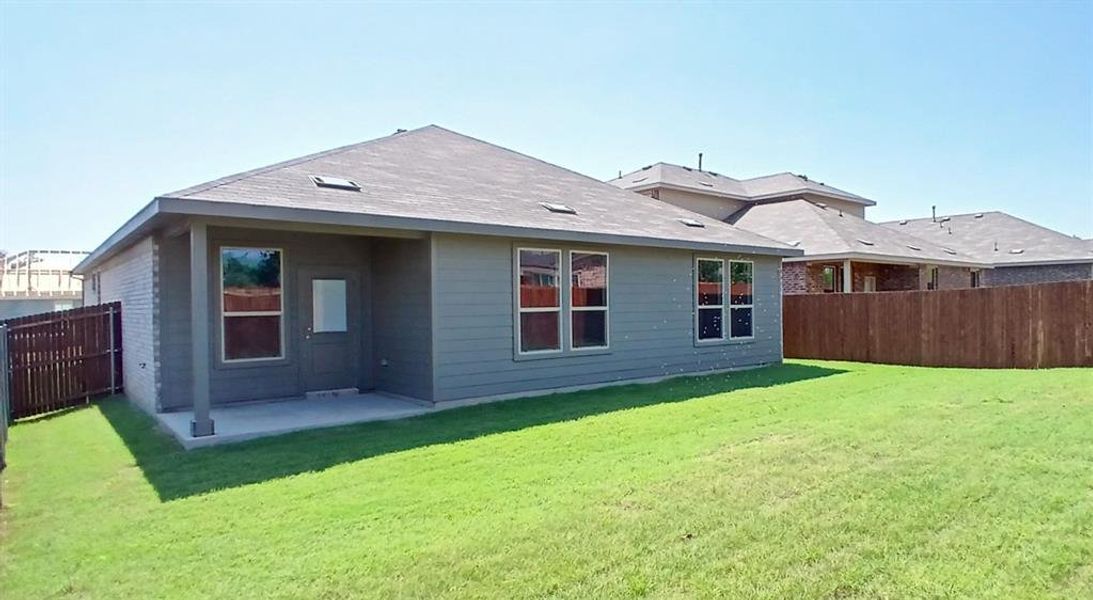 Front exterior of a new home in The Canyons, Keene, TX, highlighting curb appeal (Image 12).