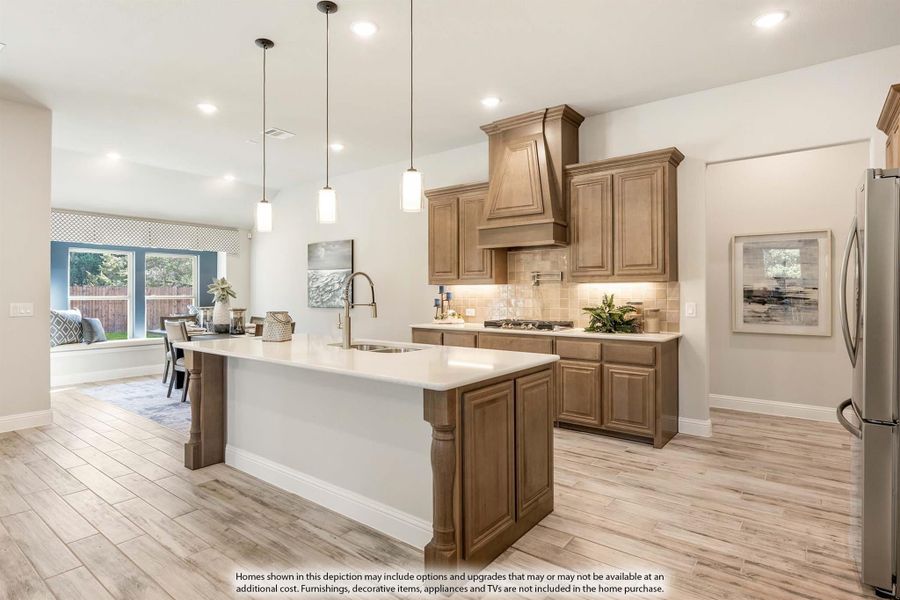 Kitchen with large center island, brown wood cabinets, custom range hood, and pendant lights over white countertops Kitchen with large center island, brown wood cabinets, custom range hood, and pendant lights over white countertops