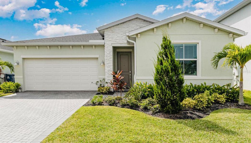 Front exterior of a new home in , Palm Bay, FL, highlighting curb appeal (Image 1). Front exterior of a new home in , Palm Bay, FL, highlighting curb appeal (Image 1).