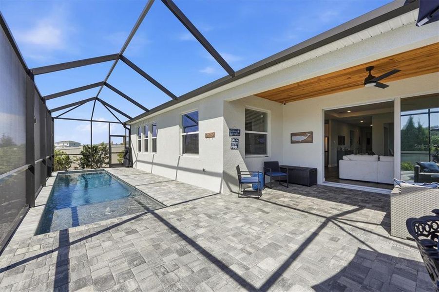 Exterior details and patio area of a home in Bella Lago, Parrish (Image 19).