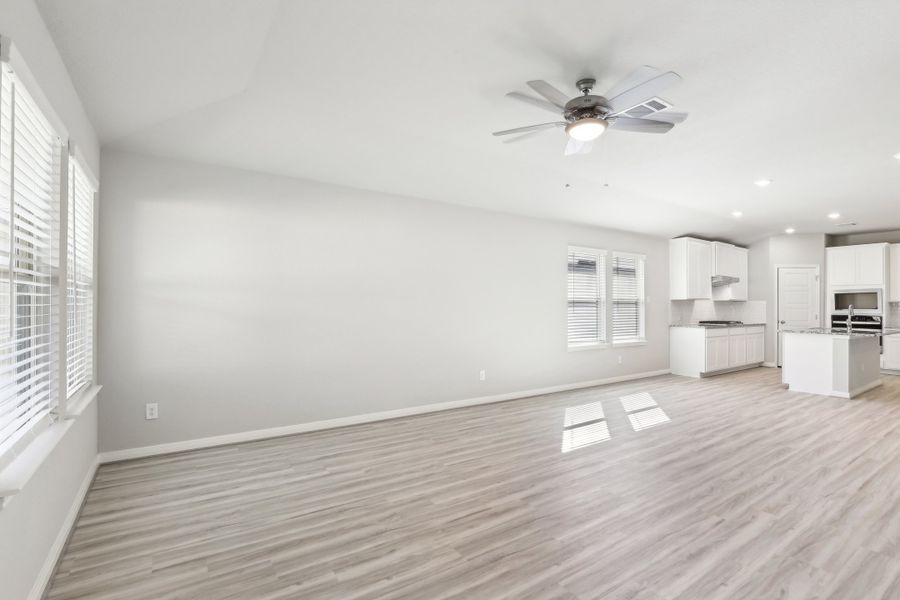 Living room and dining room in the Oleander floorplan at a Meritage Homes community. Living room and dining room in the Oleander floorplan at a Meritage Homes community.