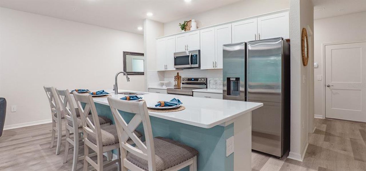Furnished interior view inside a new home in Ralston Reserve at Siena, St. Cloud (Image 9).