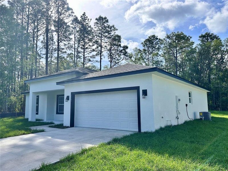 Front exterior of a new home in , Citrus Springs, FL, highlighting curb appeal (Image 14). Front exterior of a new home in , Citrus Springs, FL, highlighting curb appeal (Image 14).
