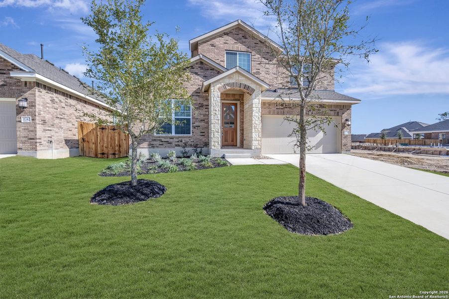 Front exterior of a new home in Davis Ranch 50', San Antonio, TX, highlighting curb appeal (Image 22).