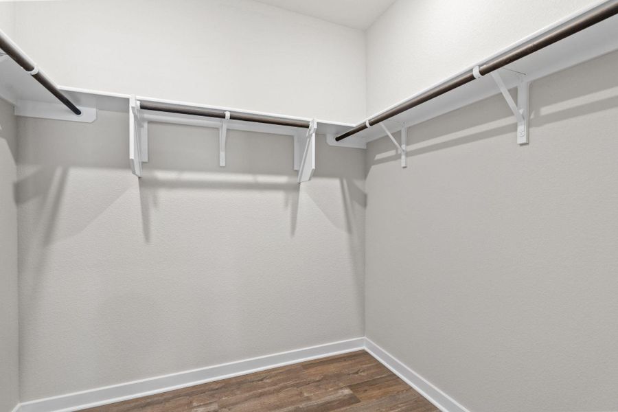 Walk-in closet in Primary Bedroom Walk-in closet in Primary Bedroom