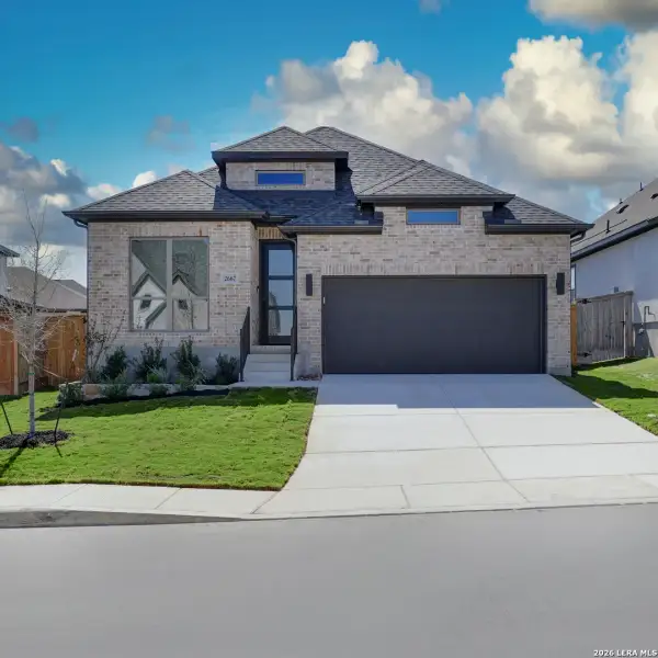 Front exterior of a new home in Ladera, San Antonio, TX, highlighting curb appeal (Image 2). Front exterior of a new home in Ladera, San Antonio, TX, highlighting curb appeal (Image 2).