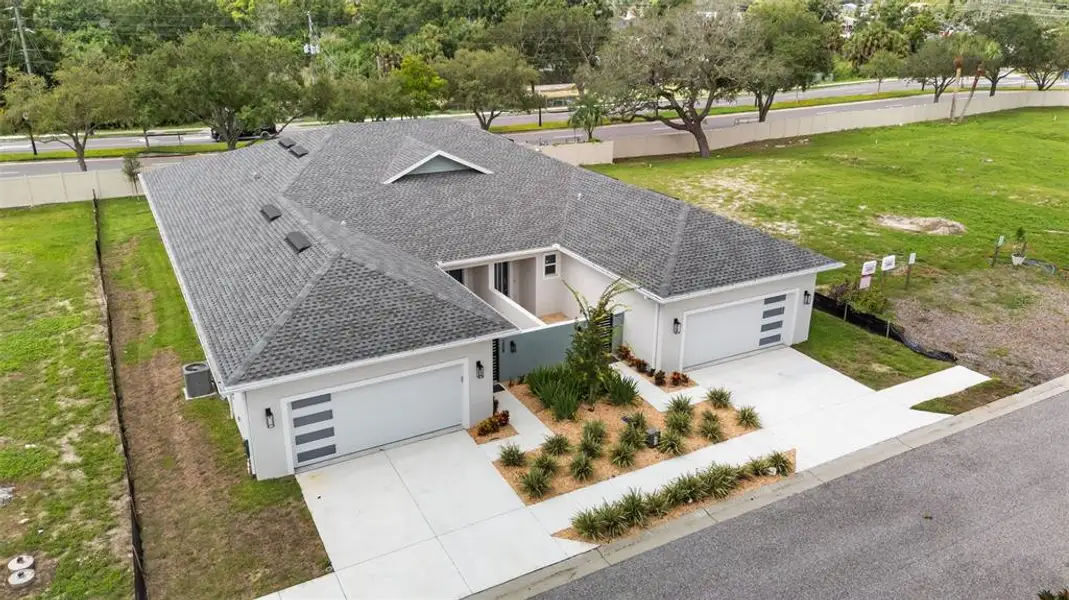 Front exterior of a new home in , Tarpon Springs, FL, highlighting curb appeal (Image 25).