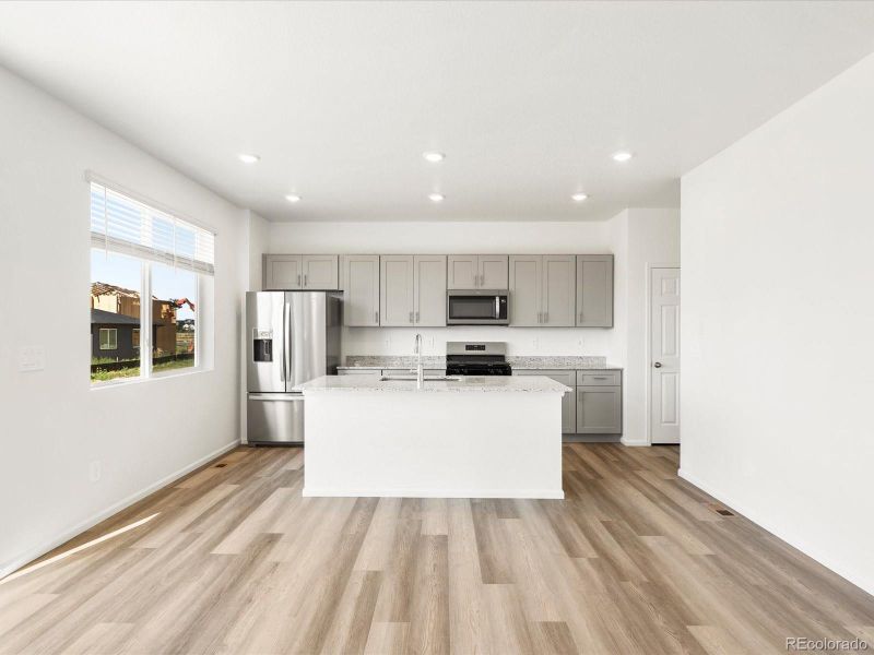 Spacious, unfurnished interior of a new home in Ridgeline Vista: The Flora Collection, Brighton (Image 22).