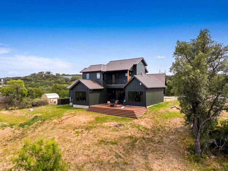 Bold vertical siding and a standing-seam metal roof define this striking modern exterior design.