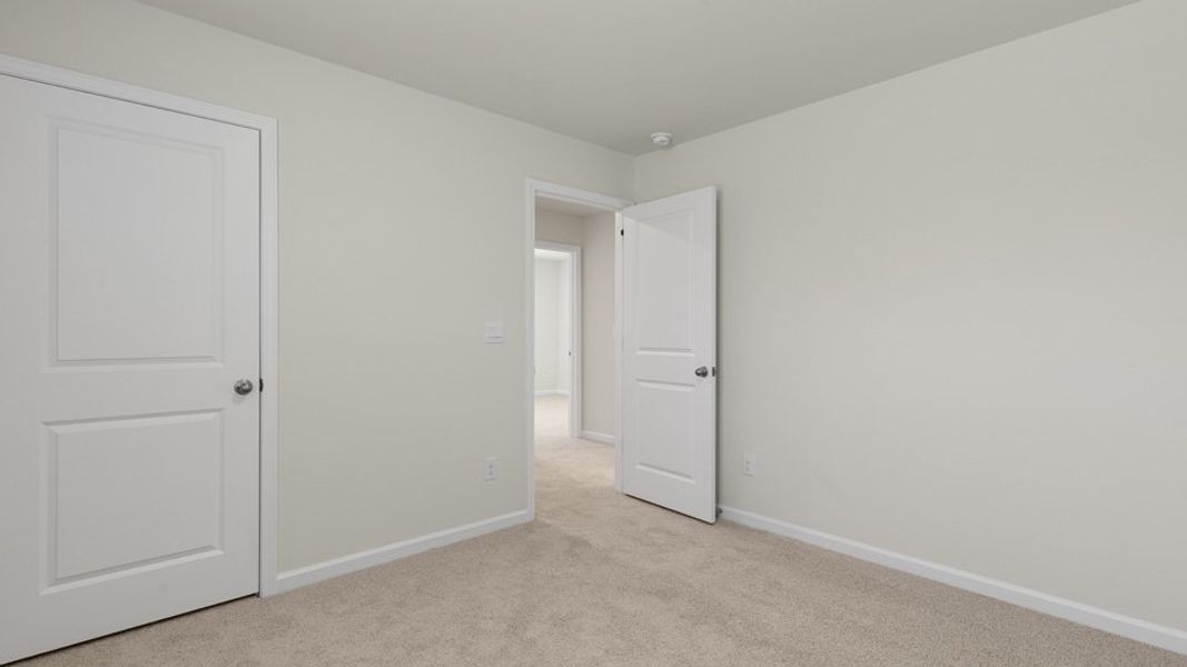 Spacious, unfurnished interior of a new home in The Grove at Matthews Landing, Fuquay Varina (Image 22).