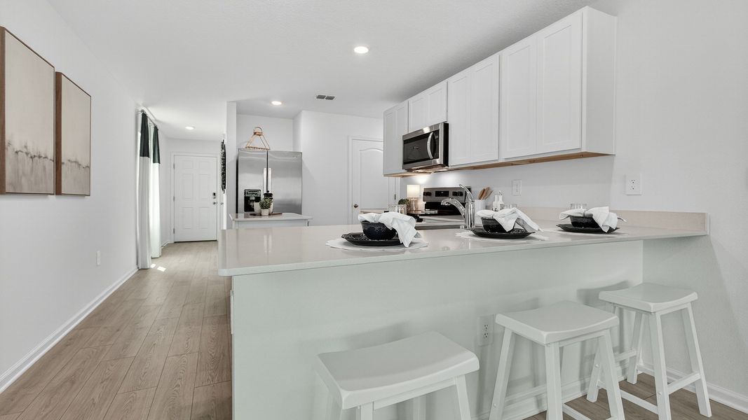 Representative furnished interior of a home built from the Carson by D.R. Horton in Trout River, Jacksonville (Image 7).