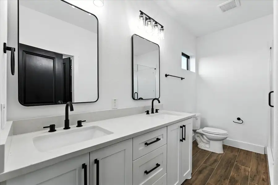 The en-suite bath boasts dual sinks, plenty of vanity storage, a walk-in shower and a walk in closet as well!