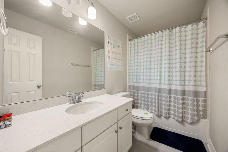 Furnished interior view inside a new home in Sunterra 60ft, Katy (Image 24).