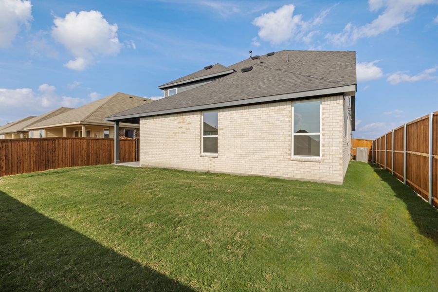Exterior details and patio area of a home in Walden Pond, Forney (Image 25).