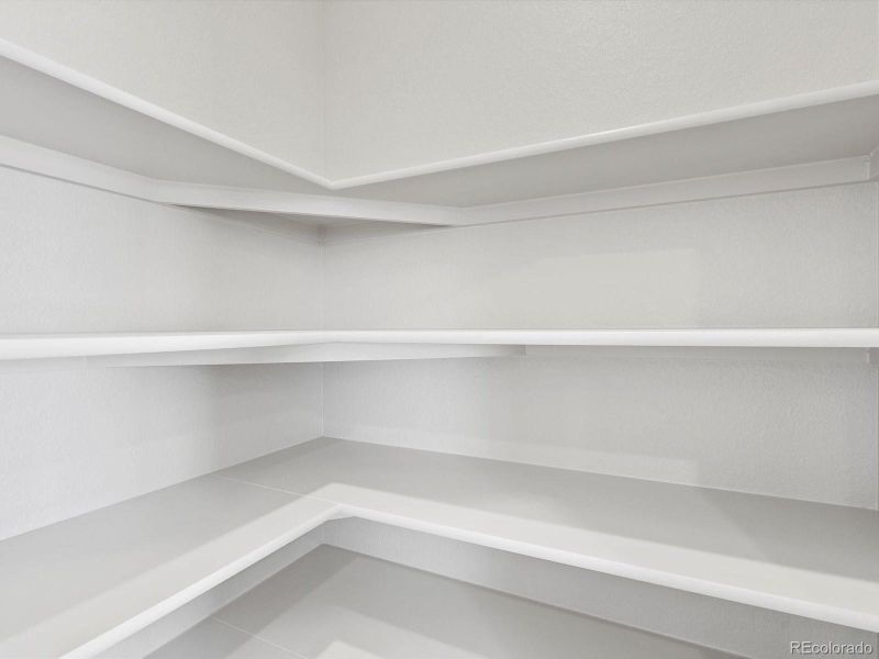 Spacious, unfurnished interior of a new home in Ridgeline Vista: The Canyon Collection, Brighton (Image 38).