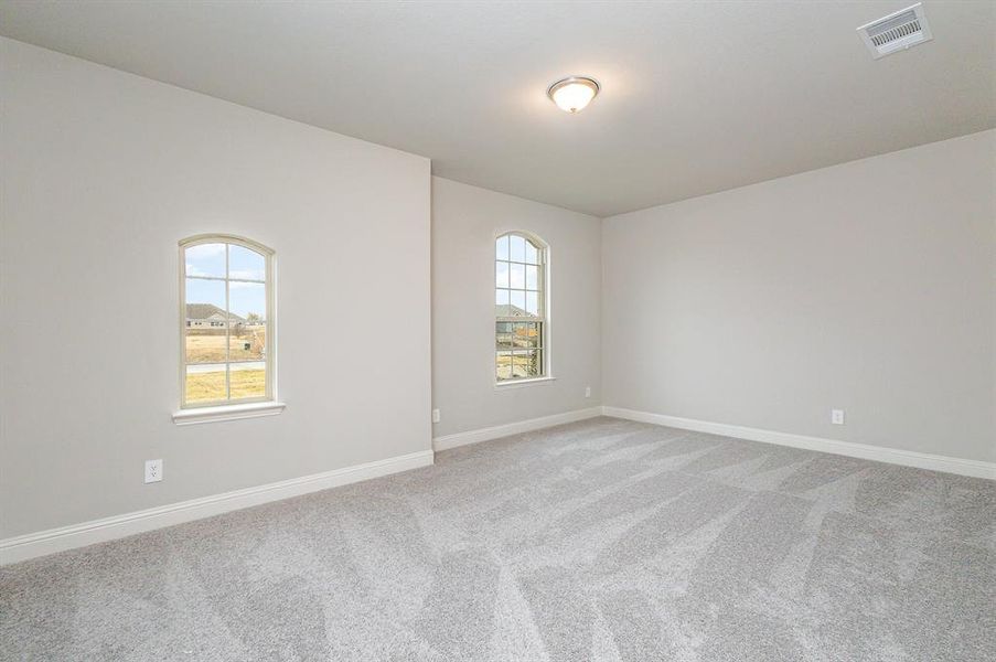 Unfurnished room featuring carpet