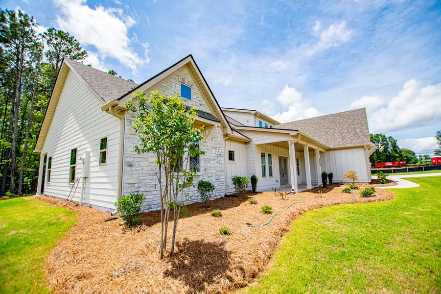 Exterior details and patio area of a home in WOODMONT RESERVE, Roopville (Image 36).