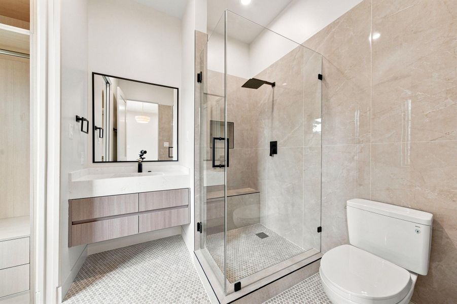 Each secondary bedroom enjoys its ownen-suite bath - five full baths in al