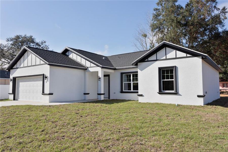 Front exterior of a new home in , Ocala, FL, highlighting curb appeal (Image 2). Front exterior of a new home in , Ocala, FL, highlighting curb appeal (Image 2).