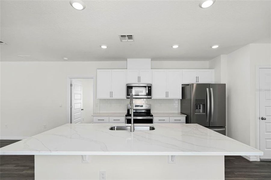 Furnished interior view inside a new home in , Winter Haven (Image 3). Furnished interior view inside a new home in , Winter Haven (Image 3).