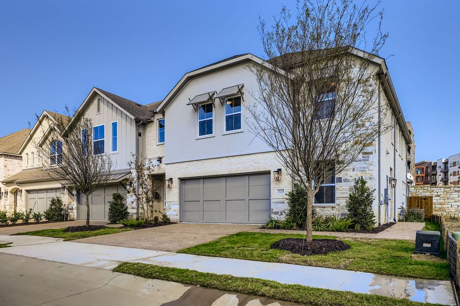 Front exterior of a new home in Castle Hills Northpointe - Townhomes, Lewisville, TX, highlighting curb appeal (Image 2).