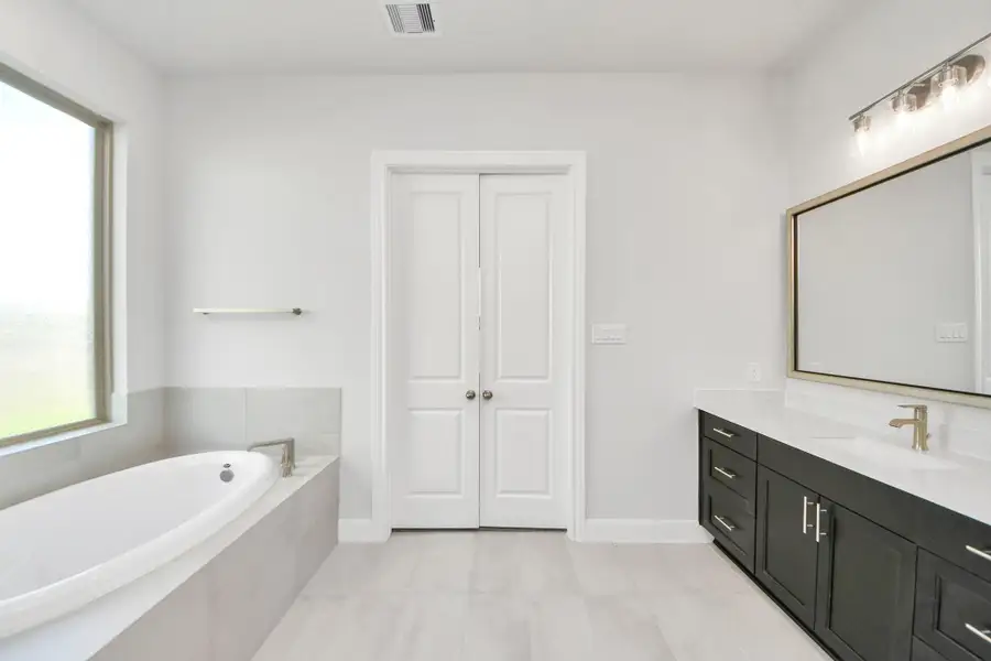 Furnished interior view inside a new home in Marvida, Cypress (Image 11).