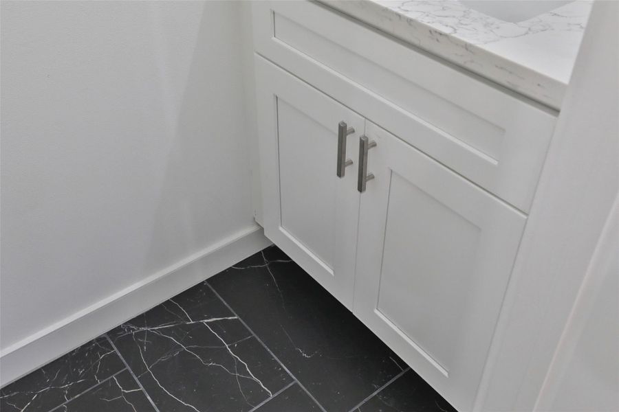 Elegant flooring enhances the powder bath. Elegant flooring enhances the powder bath.