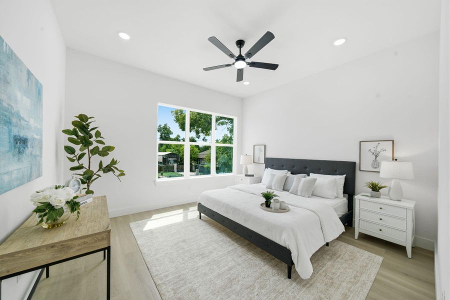 The primary suite is an oasis with large windows overlooking the front of the home.