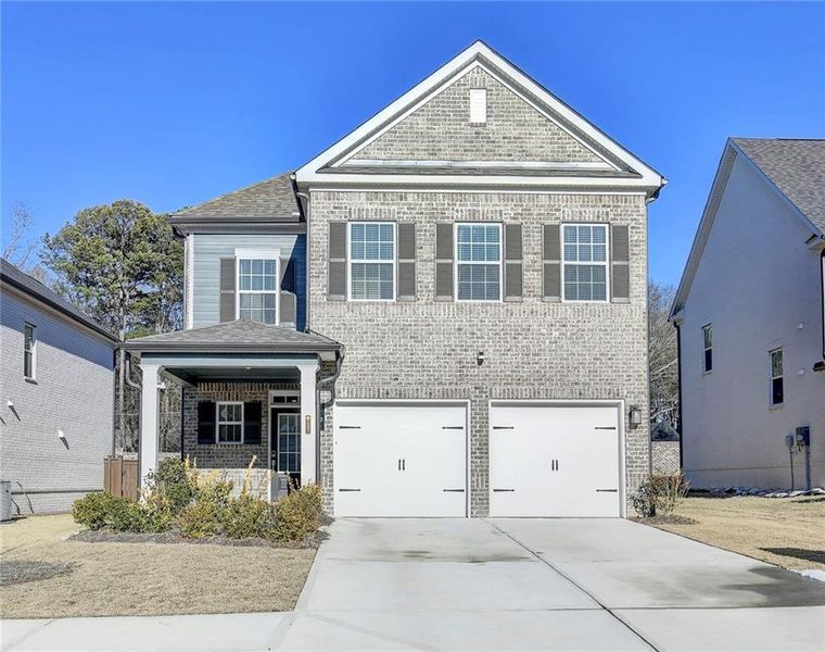 Front exterior of a new home in Graystone Village, Grayson, GA, highlighting curb appeal (Image 2). Front exterior of a new home in Graystone Village, Grayson, GA, highlighting curb appeal (Image 2).