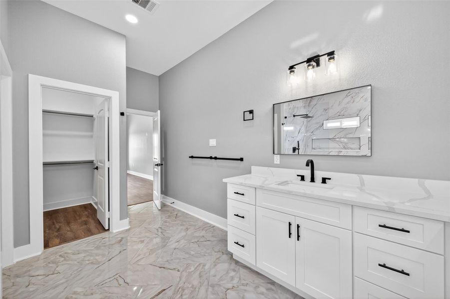 Large vanity area in primary bathroom. Large vanity area in primary bathroom.