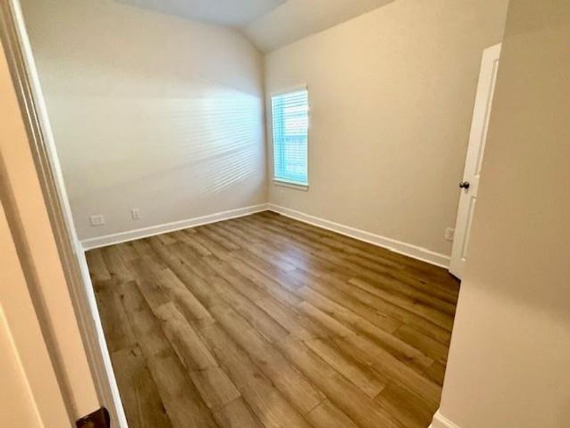 2ndary bedroom with vinyl plank floors