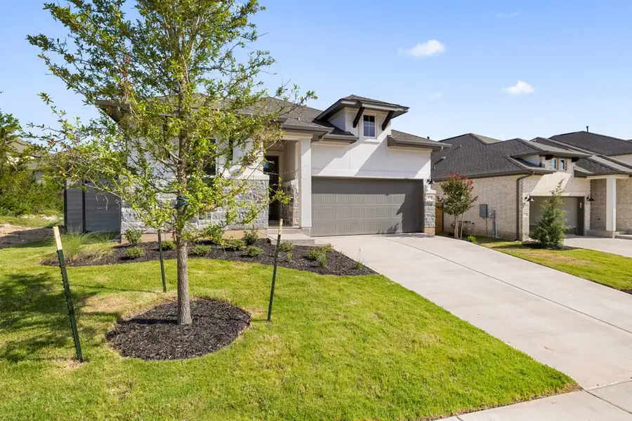 Front exterior of a new home in Arbor Collection At Wolf Ranch, Georgetown, TX, highlighting curb appeal (Image 2).