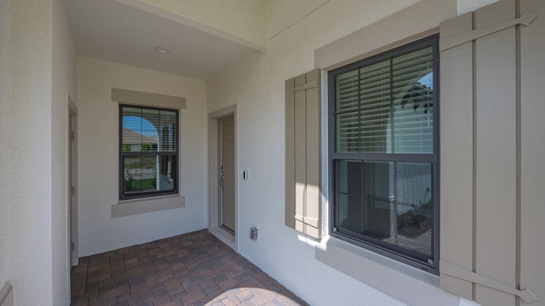 Exterior details and patio area of a home in Boca Royale Golf and Country Club at Wellen Park, Englewood (Image 3).