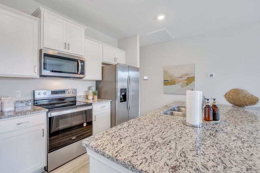 Representative furnished interior of a home built from the TUSCAN by D.R. Horton in Westbrook Retreat Villas at Savannah Quarters, Pooler (Image 7).