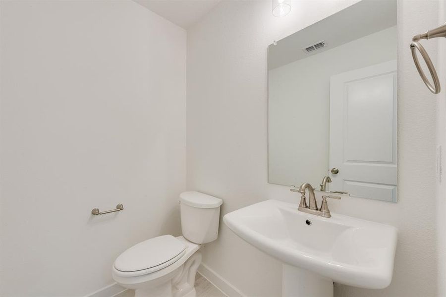 Bathroom with baseboards and toilet Bathroom with baseboards and toilet
