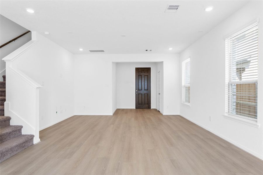 Walking into this gorgeous home, you get a feel of just how open everything is, this space showcases high ceilings, recessed lighting, open spaces and fluid floor plan, custom paint for a cooling feel, vinyl plank flooring throughout. This home is absolutely beautiful! Walking into this gorgeous home, you get a feel of just how open everything is, this space showcases high ceilings, recessed lighting, open spaces and fluid floor plan, custom paint for a cooling feel, vinyl plank flooring throughout. This home is absolutely beautiful!