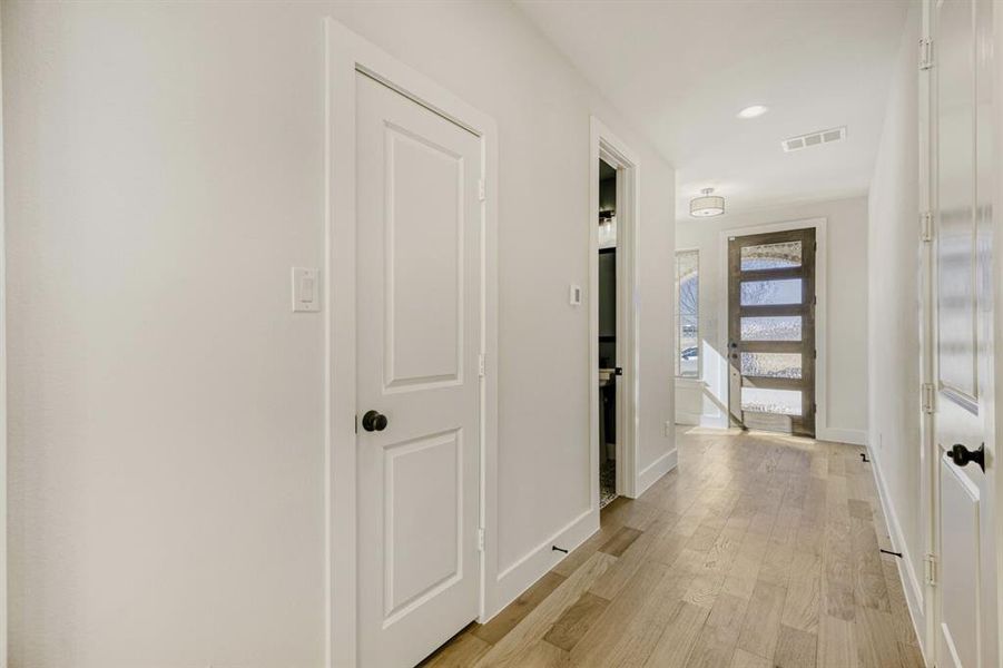 Hall featuring light wood-style flooring and recessed lighting