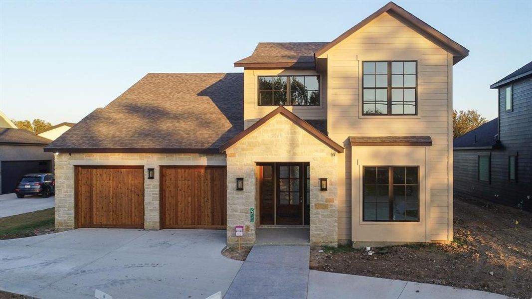 Front exterior of a new home in , Roanoke, TX, highlighting curb appeal (Image 1).
