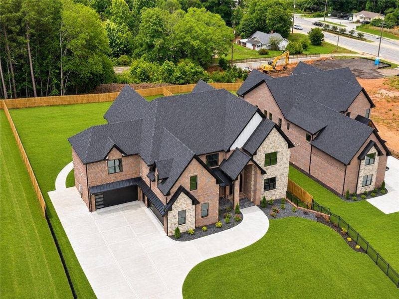 Front exterior of a new home in , Buford, GA, highlighting curb appeal (Image 34). Front exterior of a new home in , Buford, GA, highlighting curb appeal (Image 34).