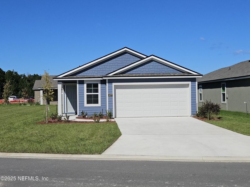 Front exterior of a new home in The Arbors, Jacksonville, FL, highlighting curb appeal (Image 25). Front exterior of a new home in The Arbors, Jacksonville, FL, highlighting curb appeal (Image 25).