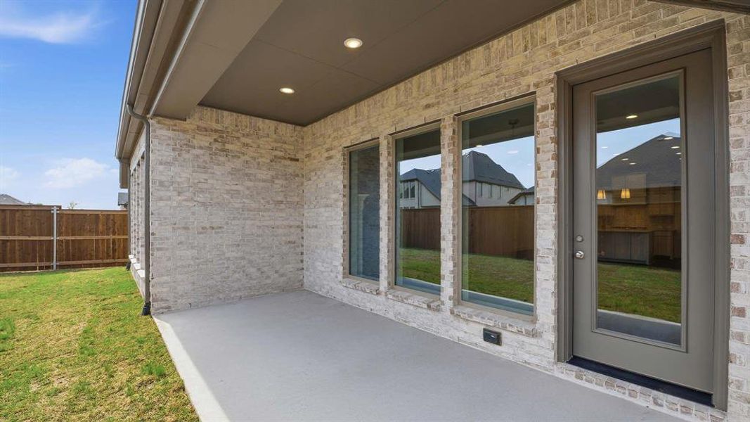 Exterior details and patio area of a home in Cambridge Crossing, Celina (Image 2). Exterior details and patio area of a home in Cambridge Crossing, Celina (Image 2).