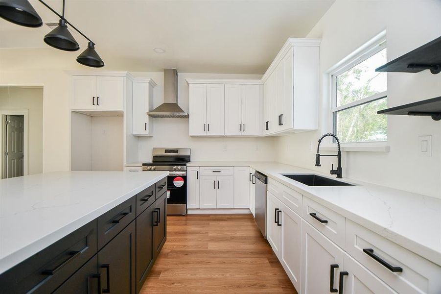 Ample storage: You'll love the generous cabinet space featuring beautiful white cabinetry accented with sleek black hardware for a modern vibe. Plus, the open shelving adds a cheerful touch and makes it easy to access your favorite items!