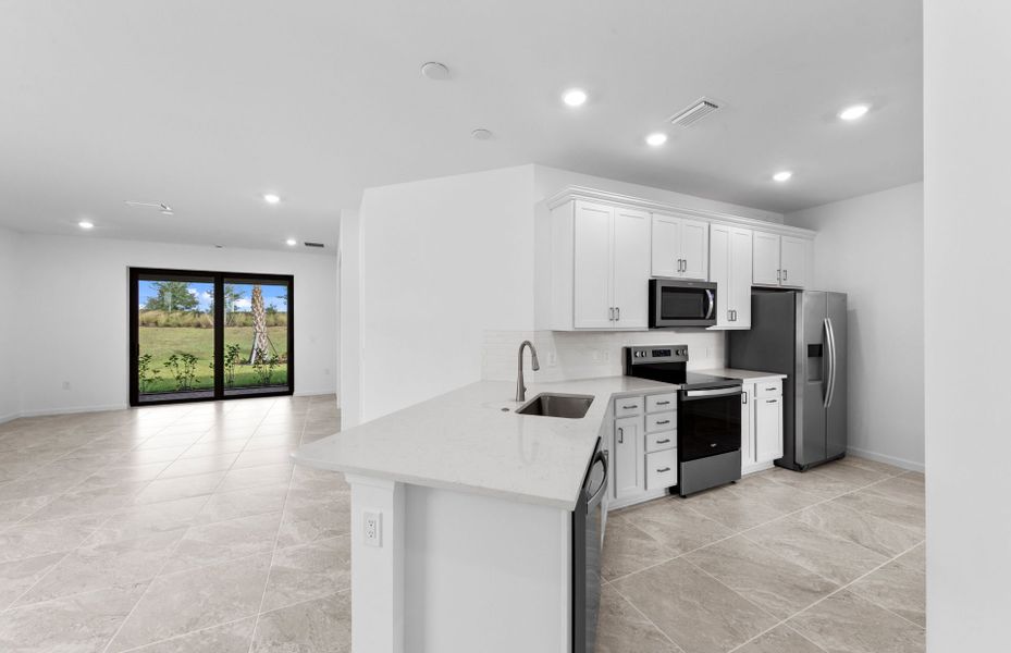 Furnished interior view inside a new home in Del Webb Naples, Ave Maria (Image 6).