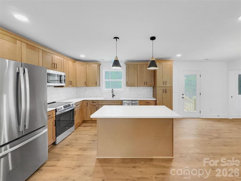 Island offers extra seating area Island offers extra seating area